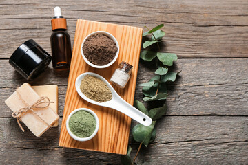 Composition with henna powder and cosmetics on wooden background