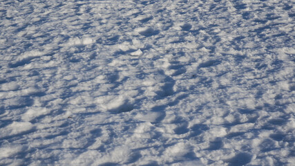 Blue trampled snow. Snow background, winter light blue background.