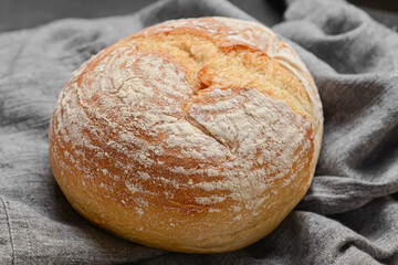 Loaf of sourdough bread on napkin