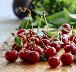 Fresh ripe cherries on wooden background