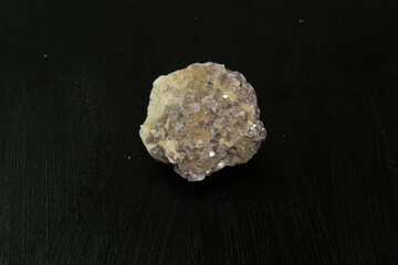 Chrysocolla from Peru. Natural mineral stone on black background. Mineralogy, geology, magic of stones, semi-precious stones and samples of minerals. Close-up macro photo.