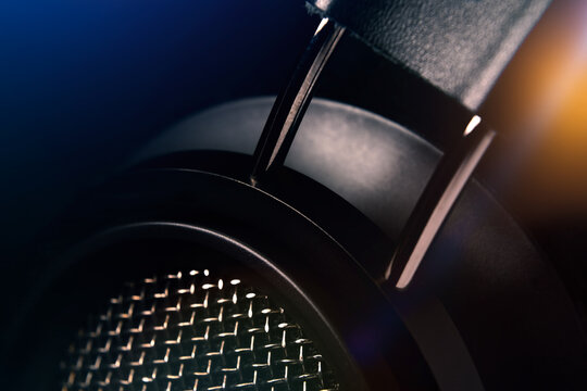 Headphone detail close-up on a black background