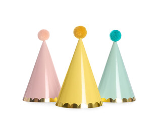 Bright birthday party hats on white background