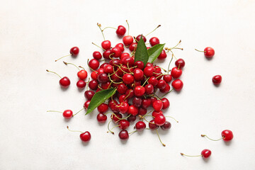Heap of tasty ripe cherry on light background