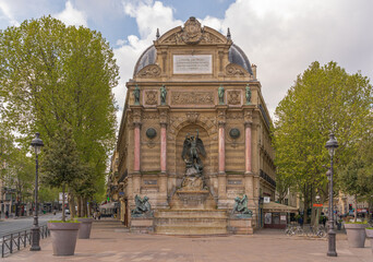 Fototapeta na wymiar Paris, France - 05 02 2021: Latin quarter. Saint-Michel fountain, struggle of good against evil.