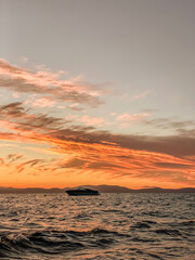 sunset on the lake with boat
