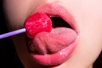 Woman licking lollipop, art banner, red lips with lollipop. Sexy red female mouth and tongue with...