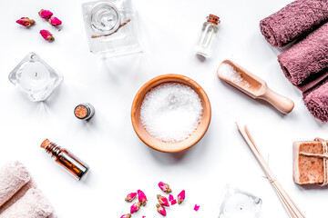 Fototapeta na wymiar Aromatherapy SPA set with salt and natural oil white background top view