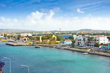 Fototapeta na wymiar Kraledijk capital town of Bonaire, Dutch Antilles, Caribbean Sea, as seen from a cruise liner ship: as flat as a pancake