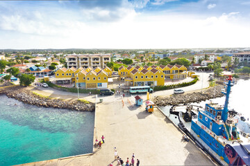 Fototapeta na wymiar Kraledijk capital town of Bonaire, Dutch Antilles, Caribbean Sea, as seen from a cruise liner ship: as flat as a pancake