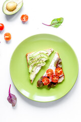 fitness breskfast with homemade sandwiches white table background top view