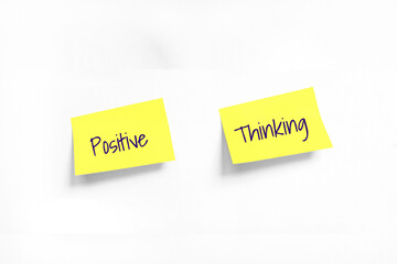 Two Yellow stickers with Positive Thincking Handwriting text on white Whatman paper. Concept of learning, work, programming, testing, business. Handwriting text, copy space