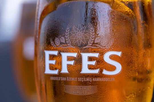 Glasses of beer Efes at outdoor sidewalk cafe of Istanbul, Turkey