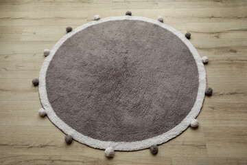 Stylish soft rug on floor, above view