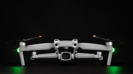Front View on the drones gimbal and camera - professional drone - isolated on black background.