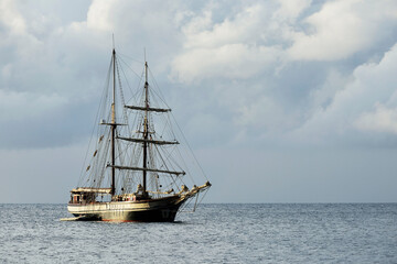 Fototapeta na wymiar Vintage vessel anchored in the quiet sea