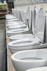 Lot of white toilets in hardware store, plumbing department