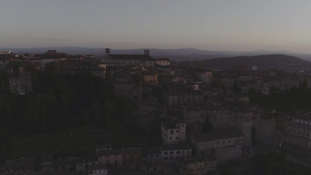 Aerial footage drone view of sunset in Perugia, Umbria, Italy, old town // no video editing
