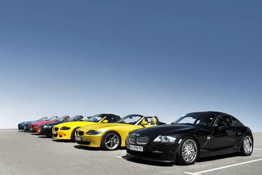 Kiev, Ukraine - May 22, 2021: Row of BMW Z4 cars on the background of clear sky. Colored BMW cars in a row
