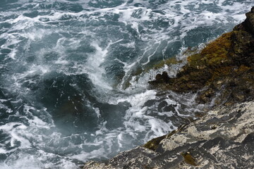 yhe waves crashing on the rocks