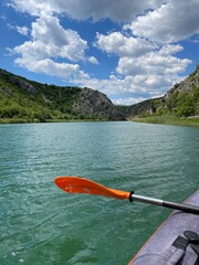 Kayak paddle. Kayaking on the Zrmanja river in Croatia. Karst landscape. Kayaking, canoeing, paddling