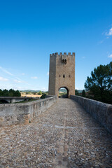 Fototapeta na wymiar View from ancient stone bridge over Ebro river at Frias. Tower and arch. Frias, Merindades, Burgos, Spain, Europe.