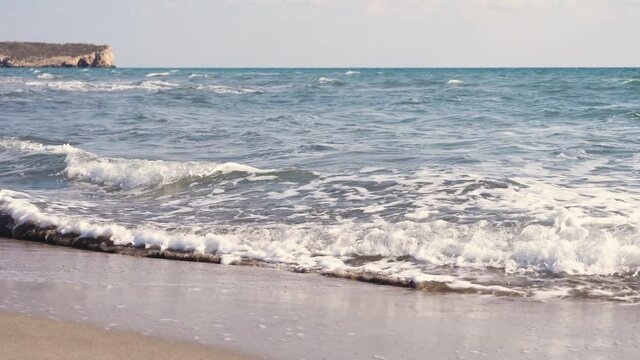 Sea waves crashing on a sand beach. Background footage