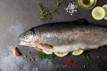 Peeled fresh salmon trout prepared with salt, dill and lemon for cooking baking