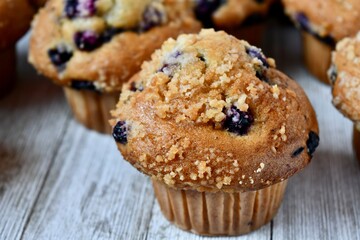 blueberry muffins on a wooden table