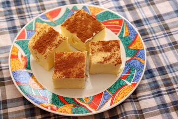 Pieces of Canjica or Curau. Typical Brazilian food made from corn. Festa Junina or São João (feast of Saint John) food concept. 