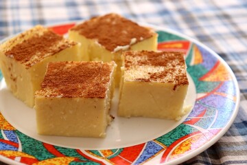 Pieces of Canjica or Curau. Typical Brazilian food made from corn. Festa Junina or São João (feast of Saint John) food concept. 