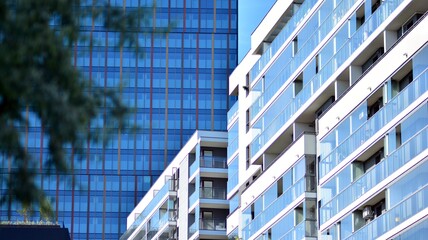 A residential building and an adjacent office building. Modern urban development.