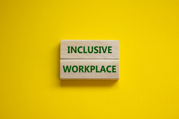 Inclusive workplace symbol. Wooden blocks with words Inclusive workplace on beautiful yellow background. Business, inclusive workplace concept. Copy space.
