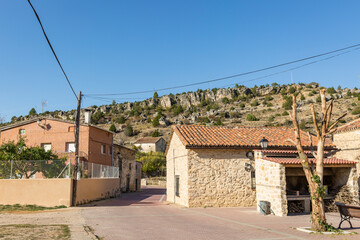 Fototapeta na wymiar a street in Fuembellida village with traditional houses, province of Guadalajara, Castile-La Mancha, Spain