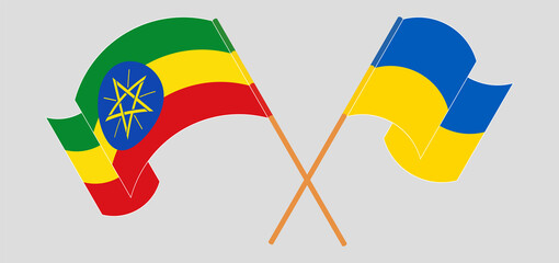 Crossed and waving flags of Ethiopia and Ukraine