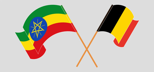 Crossed and waving flags of Ethiopia and Belgium