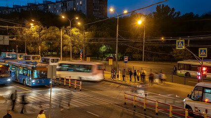 The crowd of people in the queue for the bus at rush hour  in the end of the working day