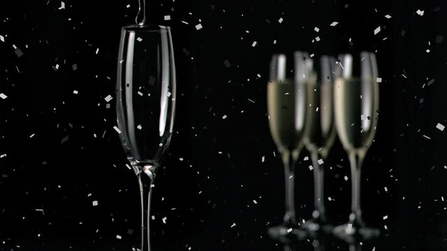Animation of champagne glasses and champagne pouring, with confetti falling on black background