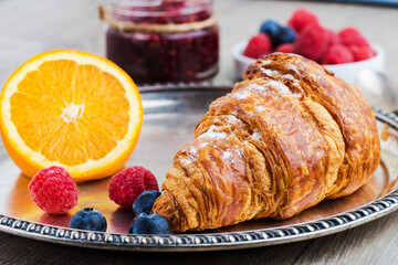 croissants with orange and raspberry jam