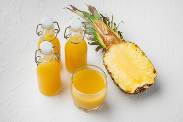 Fresh pineapple juice, on white stone table background