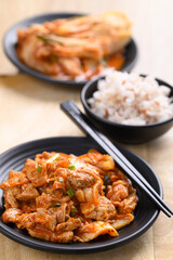 Stir-fried kimchi cabbage with pork eating with cooked rice, Homemade Korean food
