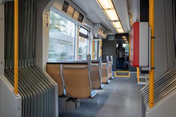 Interior view of a corridor inside passenger trains with blue fabric seats of German railway train...