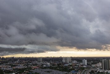 time that clouds over city sky over cost before going to rain