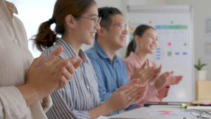 Small group asia female young happy people, sale team work in reskill upskill training class share plan idea in project research job feel bonding thankful respect greeting smile sit in office room. © ChayTee