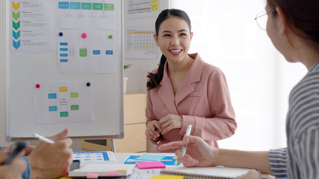 Group asia young people sale team staff or female leader work share plan idea talk in reskill upskill training class workshop seminar room. Happy workplace for data analysis project service solution.