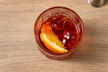 Top view of Negroni cocktail on wooden surface