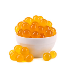 Red tapioca pearls for bubble tea isolated on white background. Tapioca pearls in white ceramic...