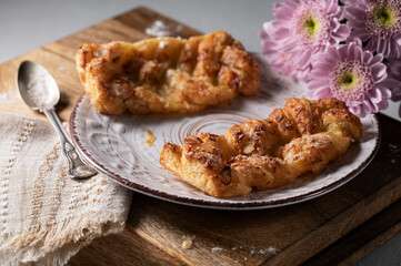 Fresh pastries and flowers on the morning table