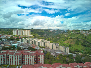 Fototapeta na wymiar Blue sky, mountains and buildings