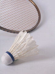 used badminton racket and shuttlecock